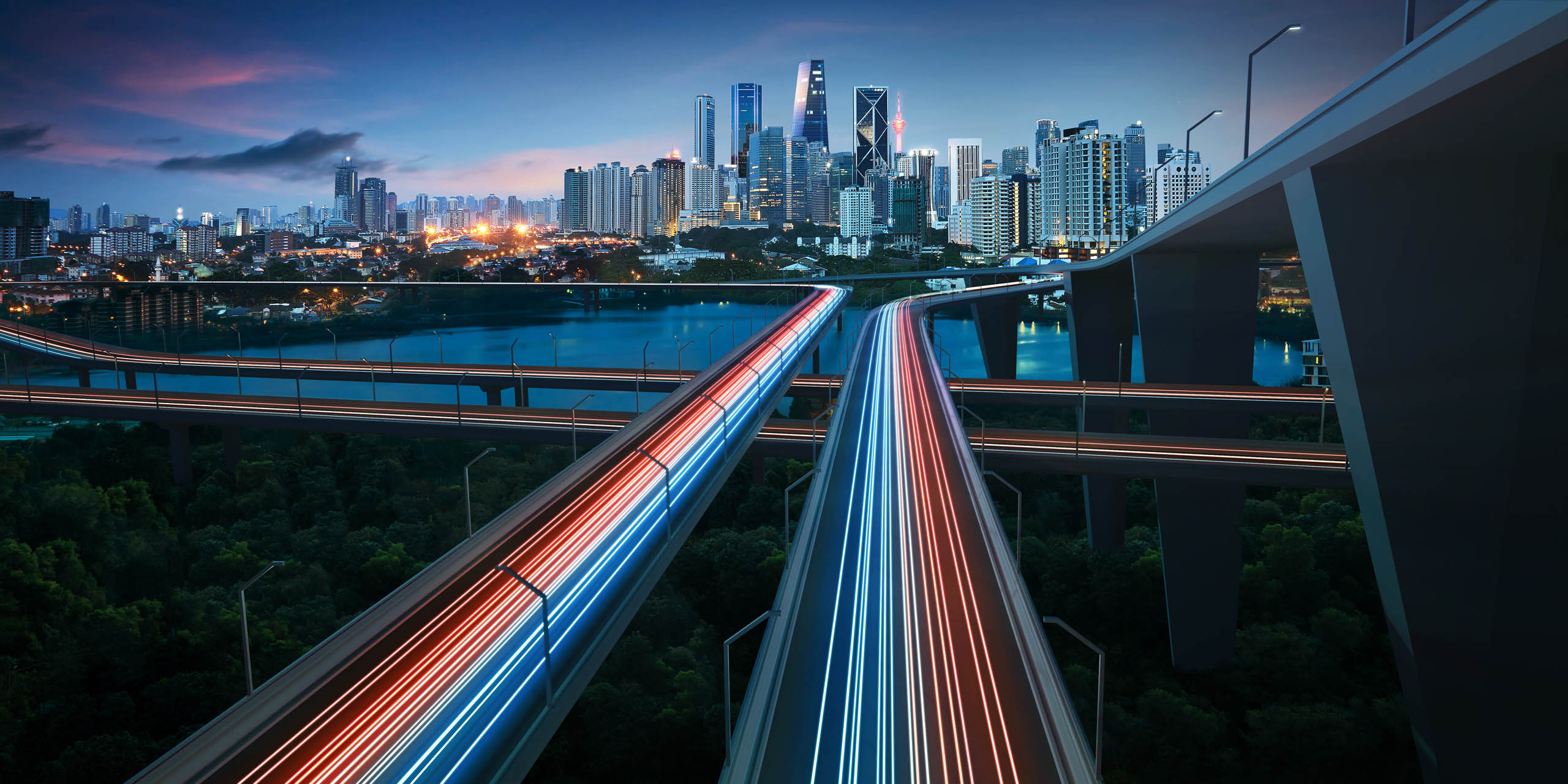 Highway,With,Vehicle,Light,Trails,Leading,To,Modern,Illuminated,Night